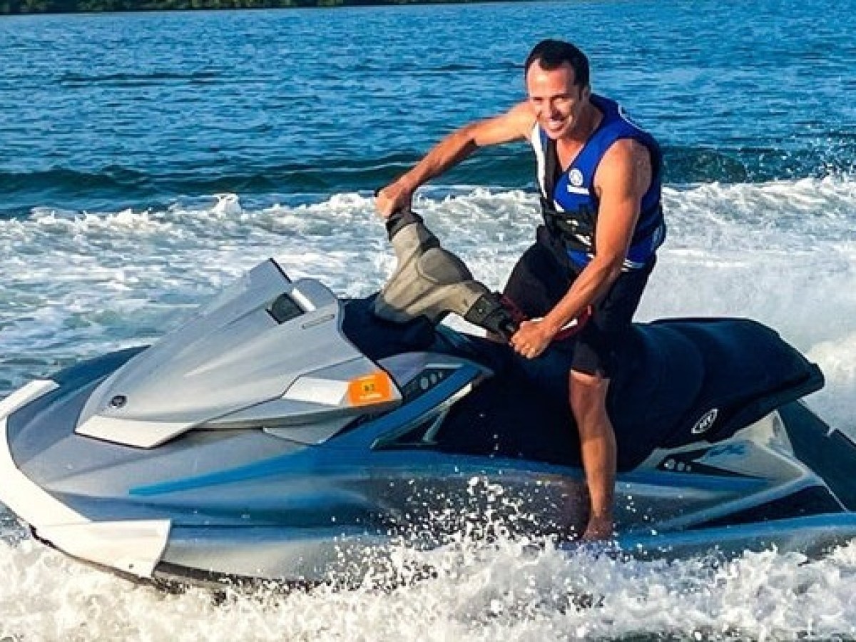 a man riding a surfboard in the water